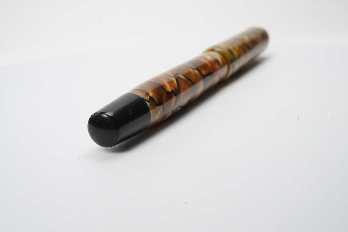 A Montblanc black and pearl fountain pen marked No.322 button filler